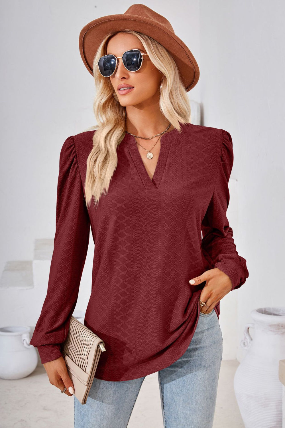Burgundy textured blouse with bishop sleeves and v-neck