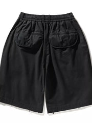 Black men's cargo shorts with elastic waistband and button-flap back pockets.