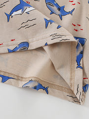 Toddler crew neck t-shirt in tan with a blue shark and red fish print.