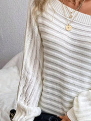 Gray/white ribbed knit sweater with one-shoulder neckline and open knit sleeves.