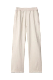 Beige seamed lounge trousers with a relaxed fit and elastic waistband.