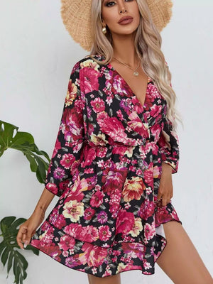 Floral ruffle hem mini dress in black with pink and yellow flowers, v-neck, 3/4 sleeves.