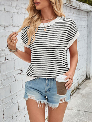 Textured stripe knit top with cap sleeves in black and white, styled casually with denim shorts.