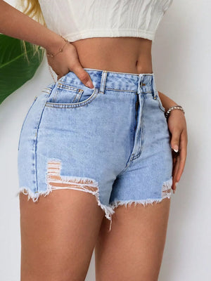 Light wash denim shorts with frayed hem and distressed rips, high-waisted cut.