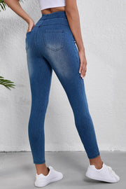 Denim-effect leggings in medium wash blue with a sculpted high rise and back pockets.