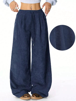 Dark blue corduroy maternity cargo pants with a relaxed fit and wide legs.