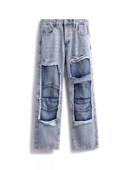 Men's light wash cotton jeans with distressed patchwork details and frayed edges.
