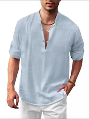 Light blue half-button full sleeve shirt with rolled cuffs and a band collar.