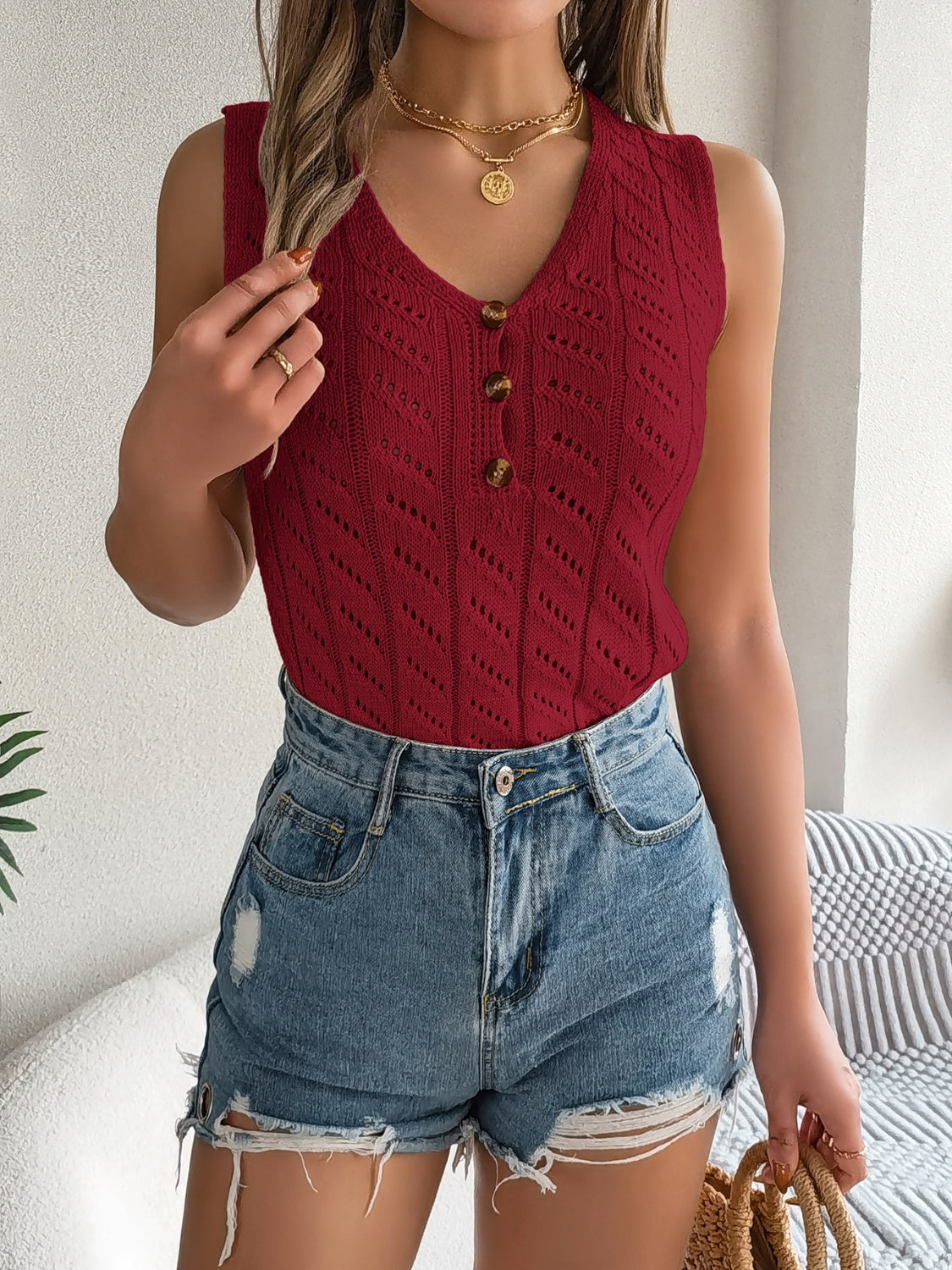 Burgundy openwork button-down knit tank top with V-neck and short sleeves.