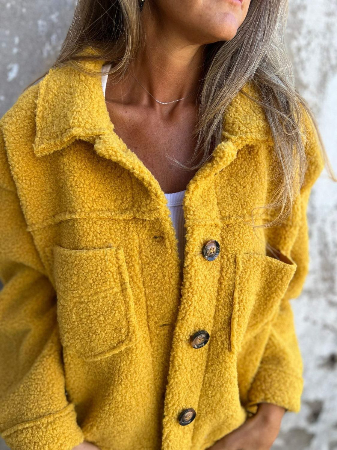 Textured sherpa utility jacket in mustard with button front and chest pockets.