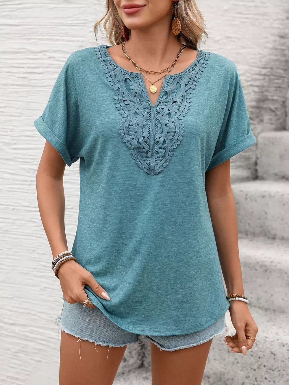 Blue-green relaxed fit t-shirt with lace neckline detail and cuffed short sleeves