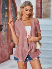 Perforated blush pink shawl collar jacket with short sleeves and pockets.