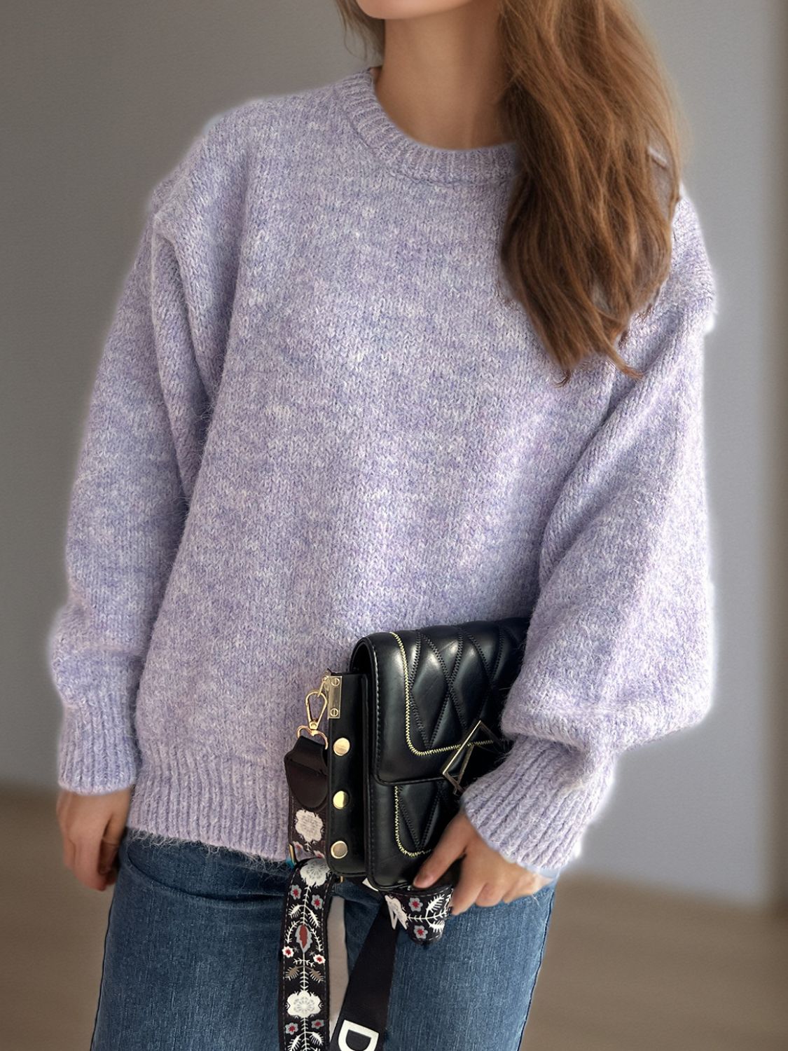Oversized crewneck lavender textured knit sweater with balloon sleeves.