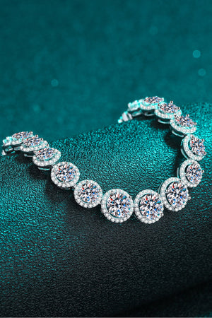 Silver halo moissanite tennis bracelet with round-cut center stones and pavé halo details.