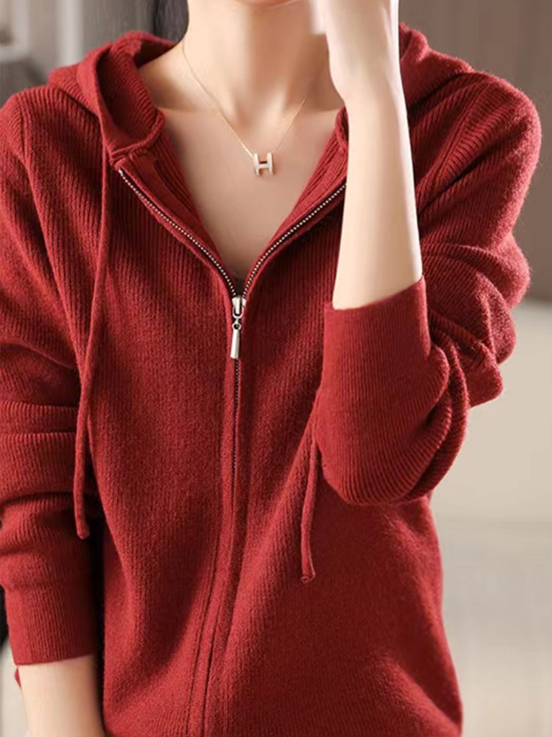 Ribbed knit zip-through hoodie in Scarlet with drawstring hood and silver zipper detail.
