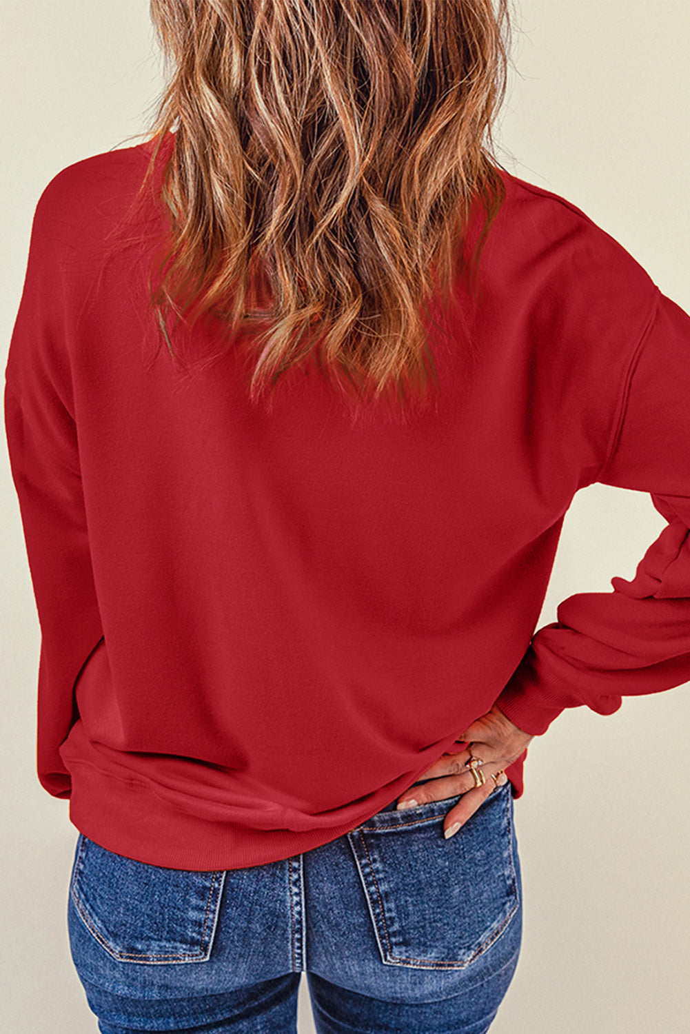 Deep Red sweatshirt with heart appliqué on sleeve, crew neck, long sleeves.