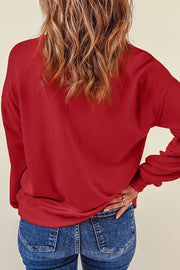 Deep Red sweatshirt with heart appliqué on sleeve, crew neck, long sleeves.