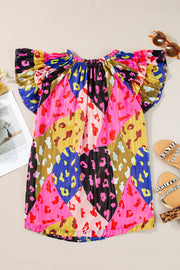 Blouse with patchwork leopard print, ruffle sleeves, and a gathered neckline in hot pink and neon green colors.