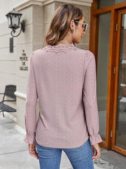 Dusty pink eyelet blouse with floral embroidered neckline and ruffle cuffs.