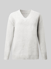 White ribbed trim V-neck knit sweater with long sleeves and a classic fit.