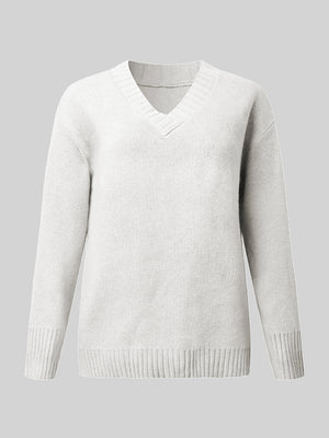 White ribbed trim V-neck knit sweater with long sleeves and a classic fit.