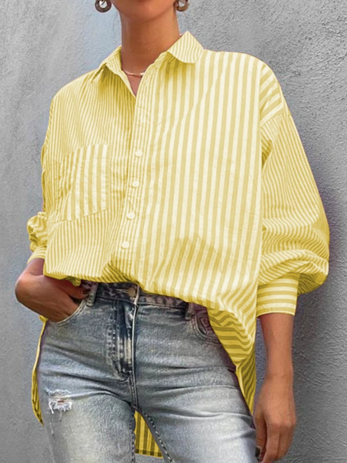 Light yellow striped oversized button-down shirt with pocket detail.