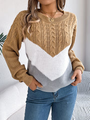 Chevron cable knit sweater in camel, white, and grey with a crew neck.