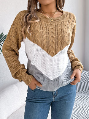 Chevron cable knit sweater in camel, white, and grey with a crew neck.