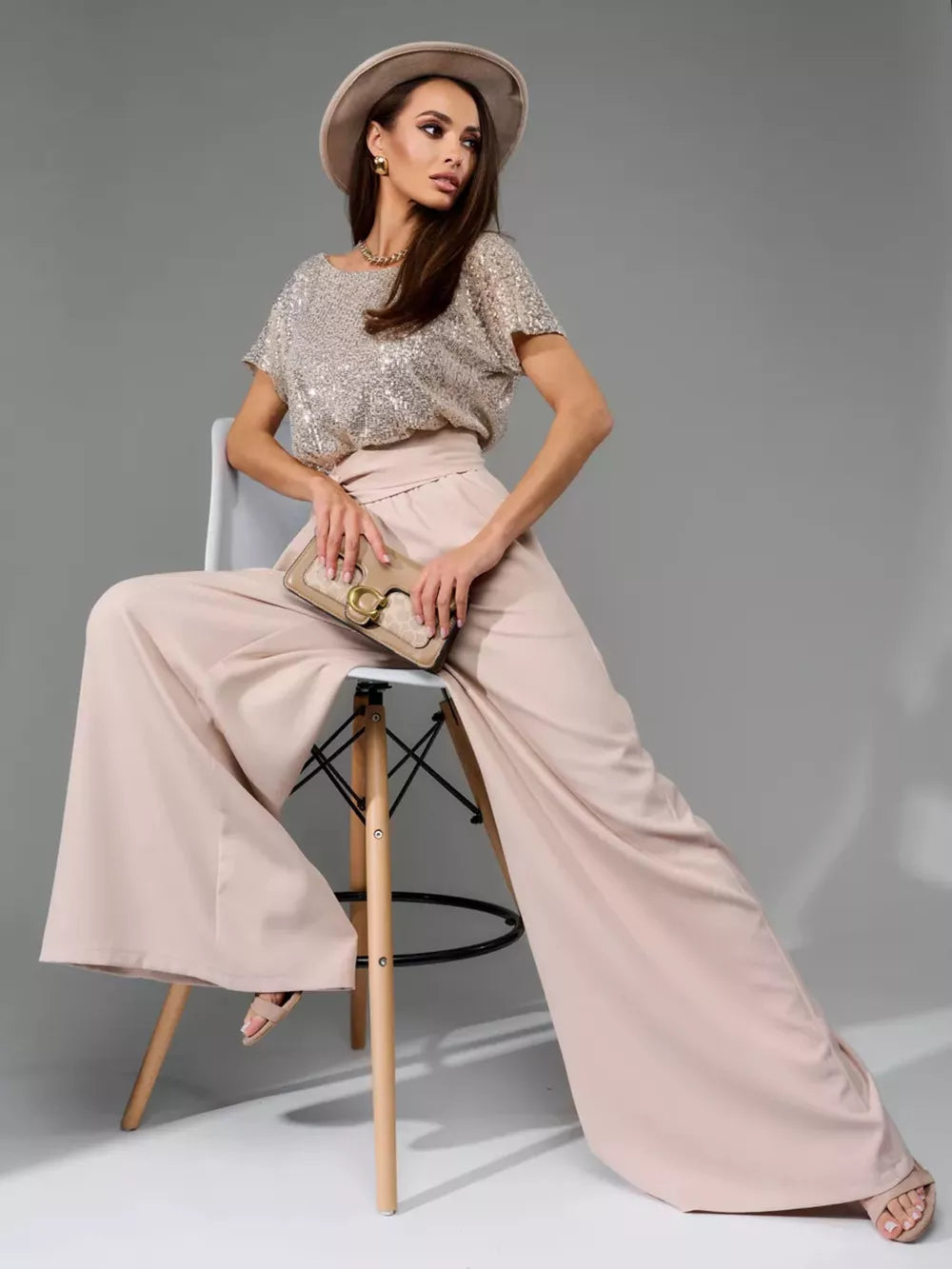 Shimmering sequin wide-leg jumpsuit with tie in apricot silver.