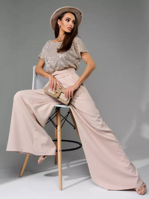 Shimmering sequin wide-leg jumpsuit with tie in apricot silver.
