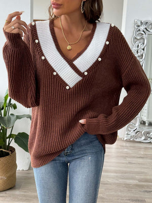 Brown ribbed knit sweater with pearl trim and V-neckline.