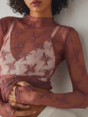 Burgundy floral lace illusion mock neck long sleeve blouse with sheer sleeves.