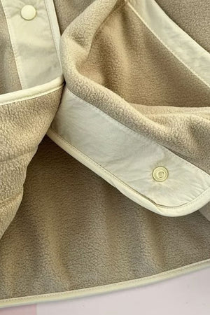 Tan fleece bomber jacket with contrast trim and snap button detail.