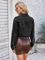 Black washed denim bolero jacket with raw hem and buttoned front, shown from the back.