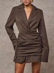 Brown blazer dress with deep V-neck, ruched waist, and ruffled hem.