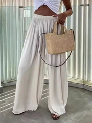 Maternity paperbag waist pants in apricot, wide leg, cotton, with adjustable fit.
