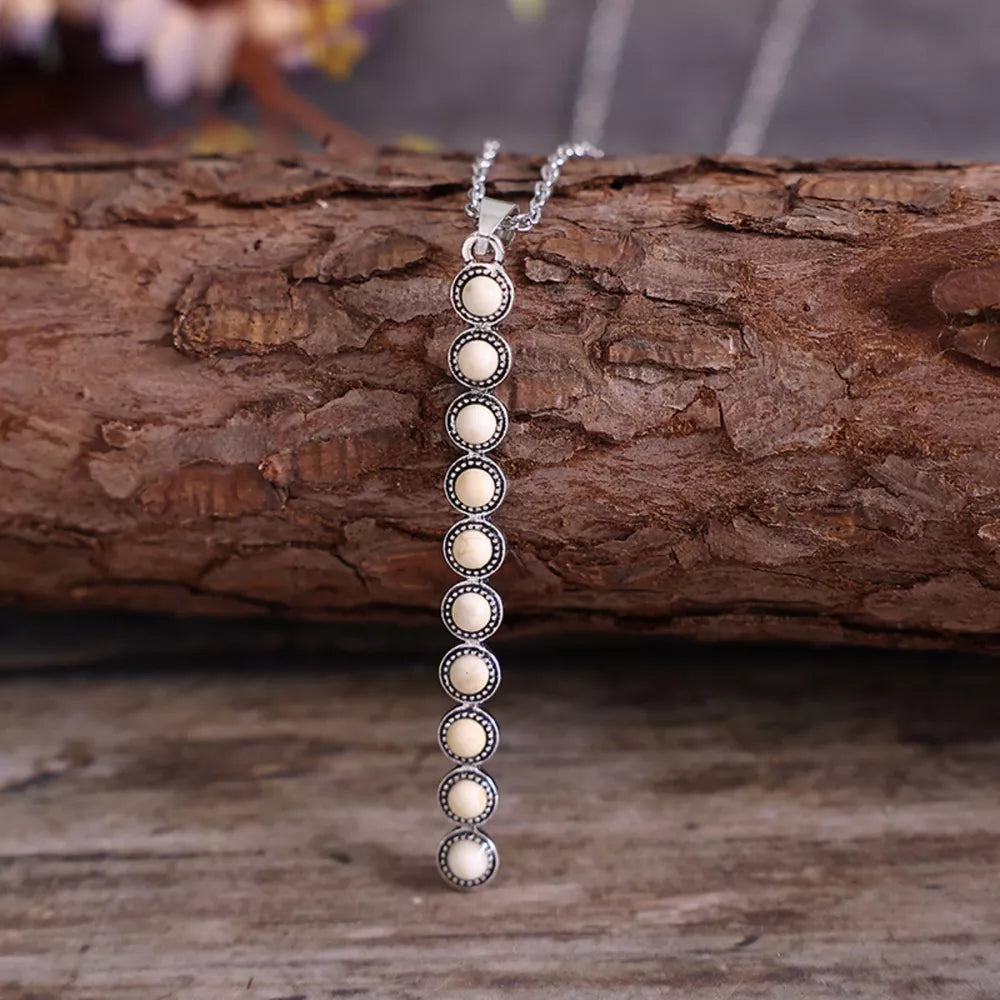Delicate white beaded pendant necklace with alloy setting