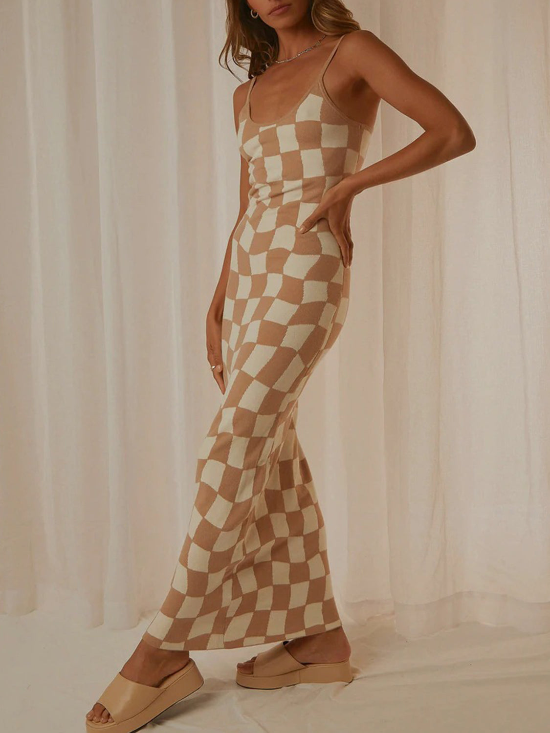 Camel and cream checkered knit maxi slip dress with a square neckline and spaghetti straps.