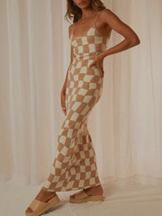 Camel and cream checkered knit maxi slip dress with a square neckline and spaghetti straps.