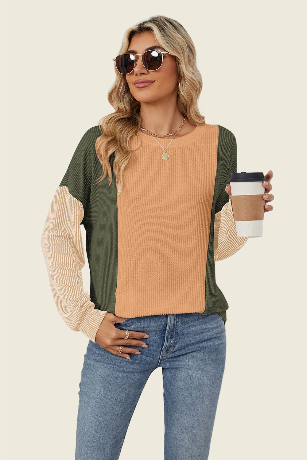 Colorblock waffle knit pullover with crew neck and long sleeves in green, tan, and cream.