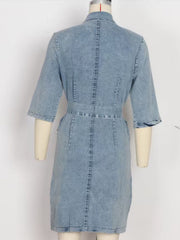 Light blue denim shirt dress with 3/4 sleeves and a belted waist.