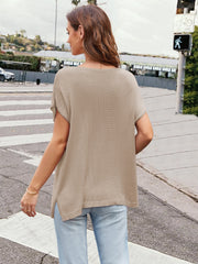 Khaki knit tee with cap sleeves and side slits, styled with jeans.