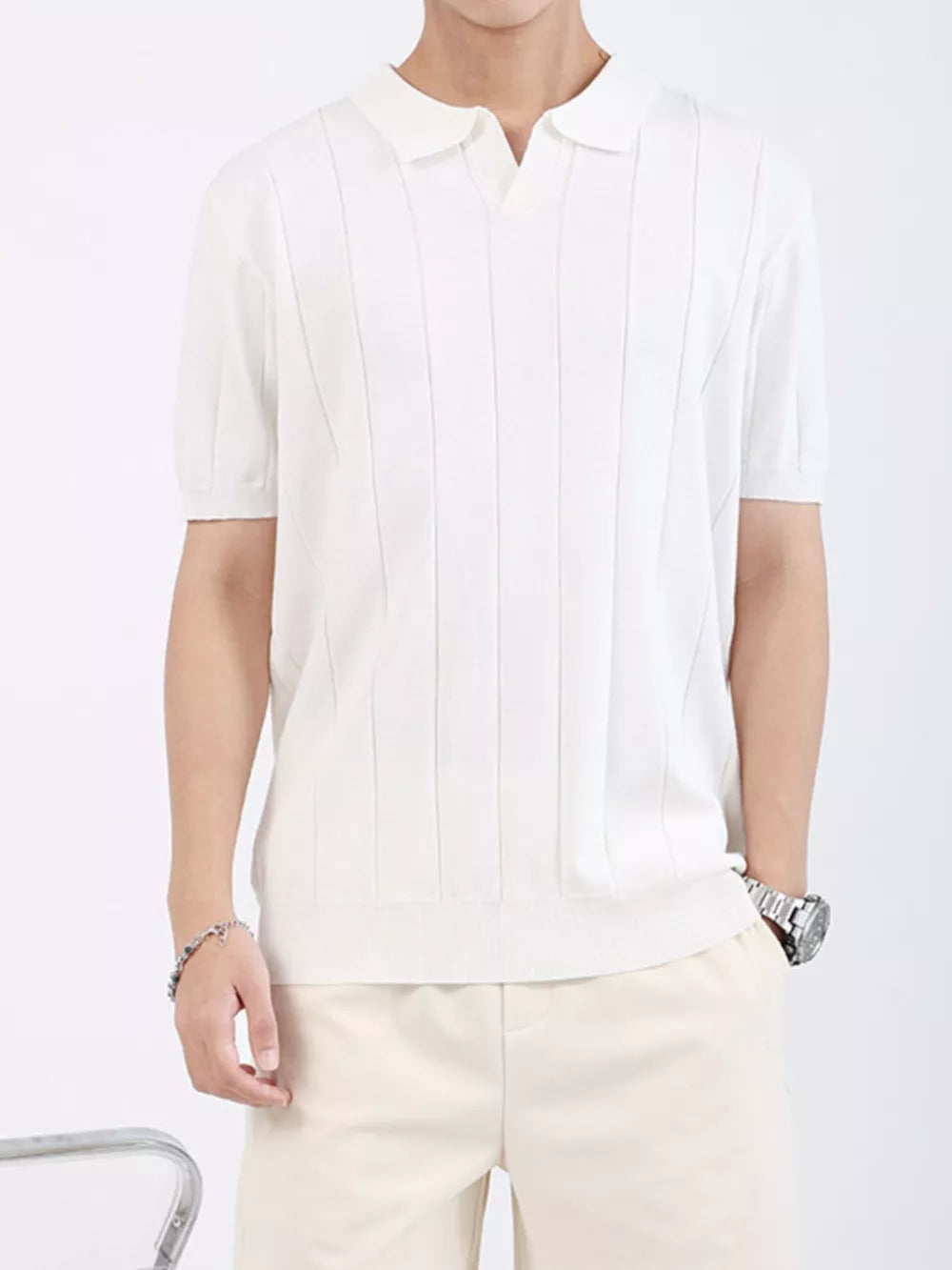 Men's white ribbed knit short sleeve polo shirt with vertical texture detail.