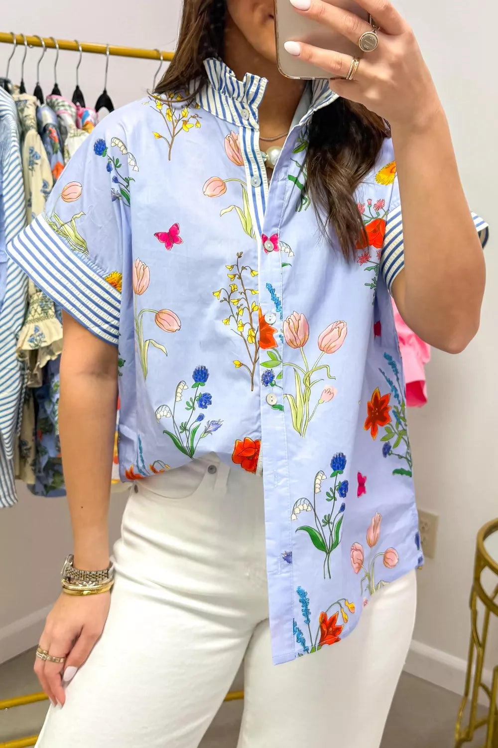 Floral patchwork maternity shirt with ruffled collar and striped cuffs.