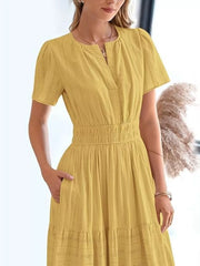 Gold ruched V-neck tiered midi dress with short sleeves and pockets