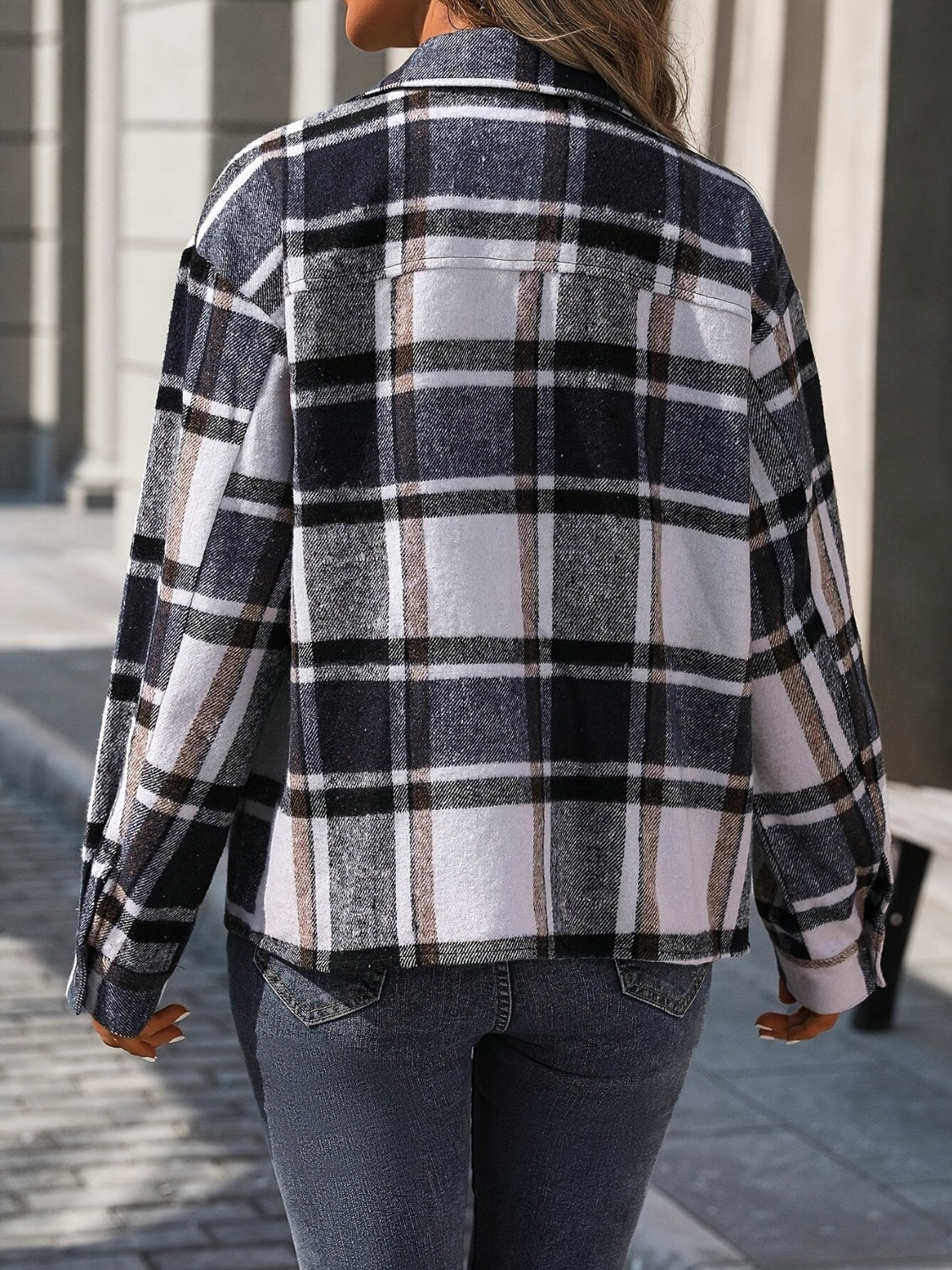 Black plaid overshirt with button front and patch pockets, shown from the back.