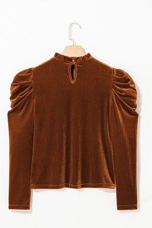Brown velvet blouse with gathered puff sleeves, mock neck, and keyhole cutout.