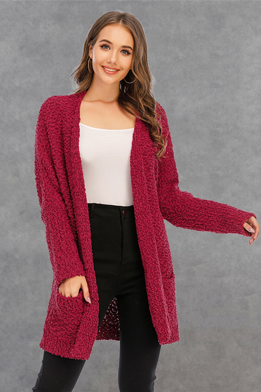 Burgundy textured cocoon cardigan with patch pockets and open front.