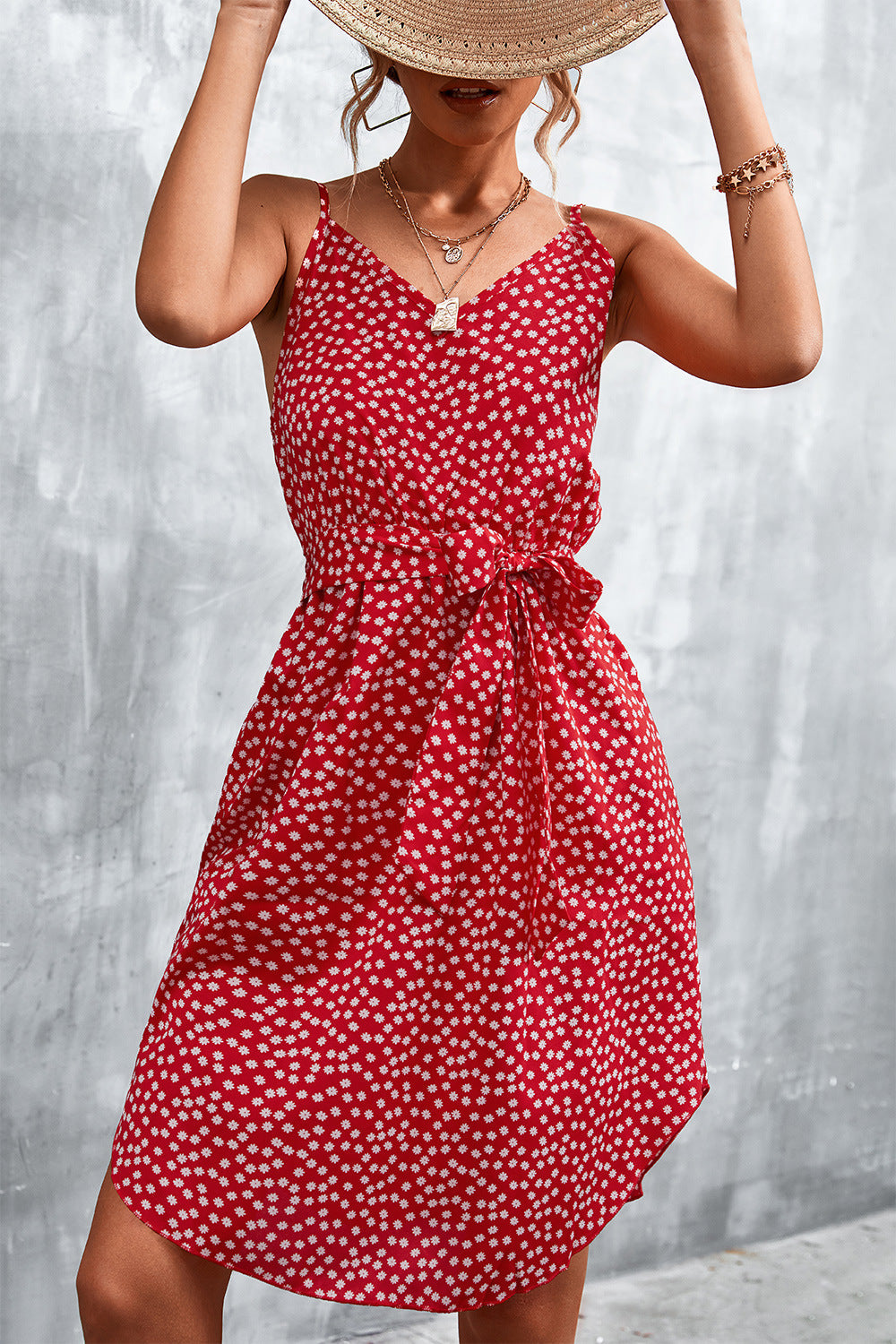 Red daisy print slip dress with tie waist and V-neckline.