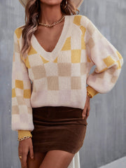 Geometric puff sleeve V-neck knit sweater in cream with yellow and tan checkerboard pattern.